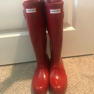 Knee-High red HUNTER rain boots.